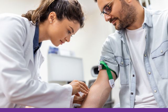 An image of a female pathology collector inserting a needle into a male patient's arm.