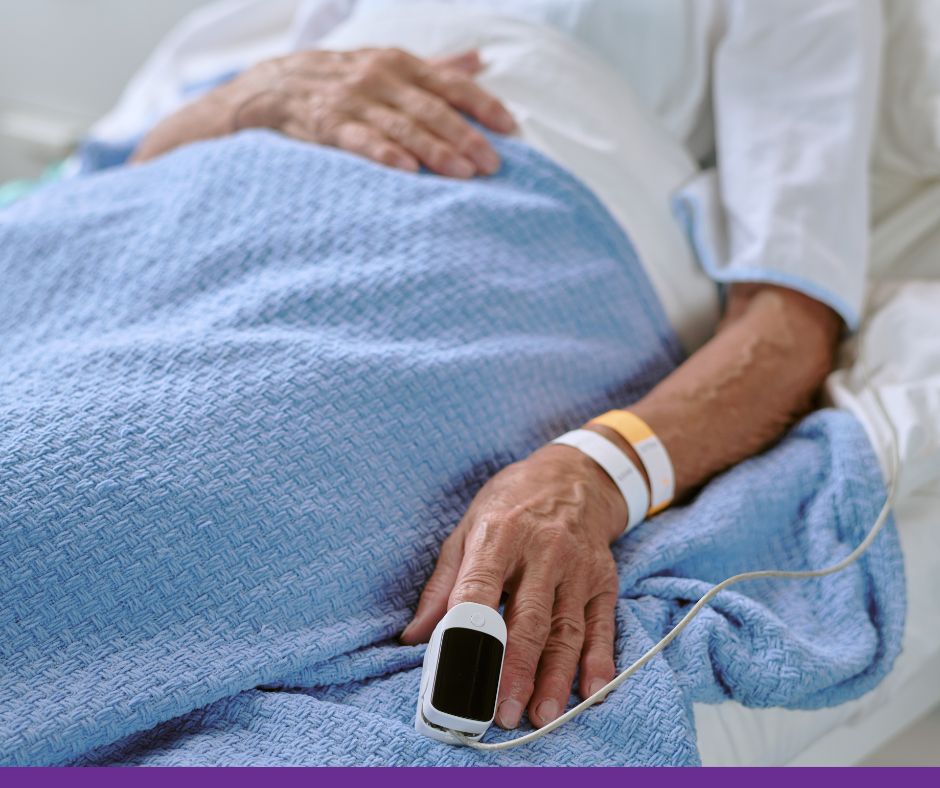An elderly patient in a hospital bed.