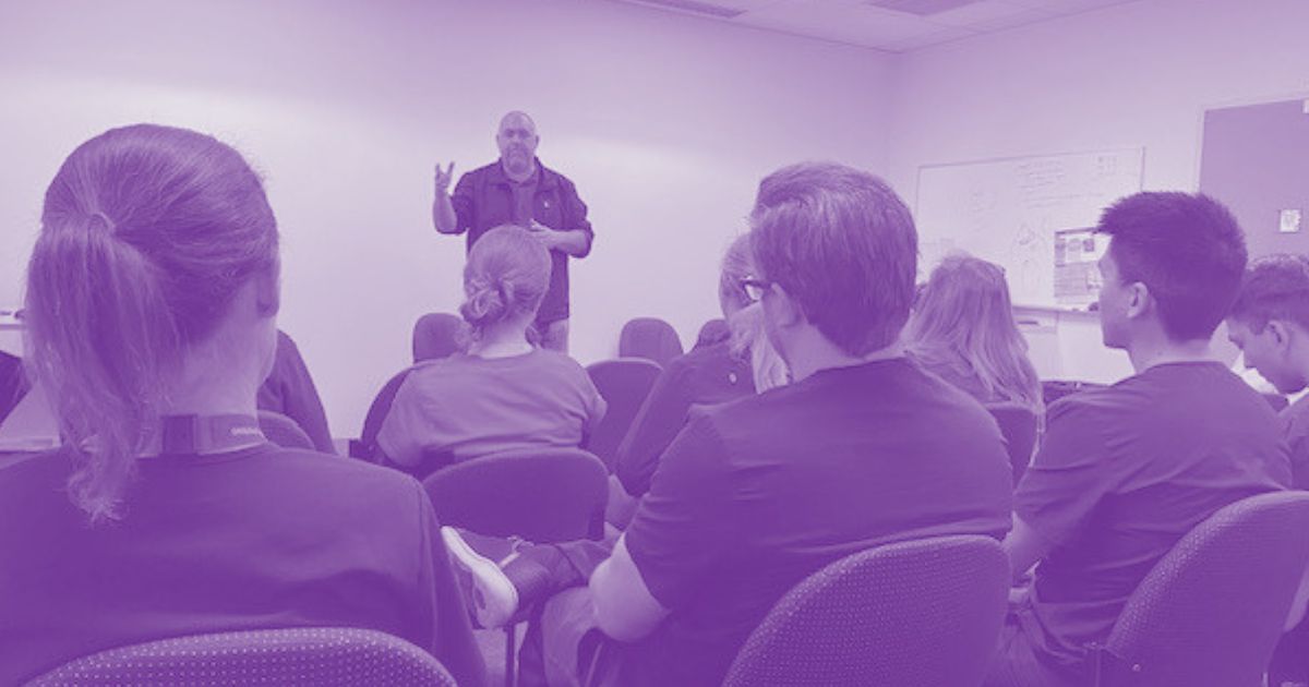 A HSUWA Organiser addresses a room of Allied Health Professionals during a union meeting.