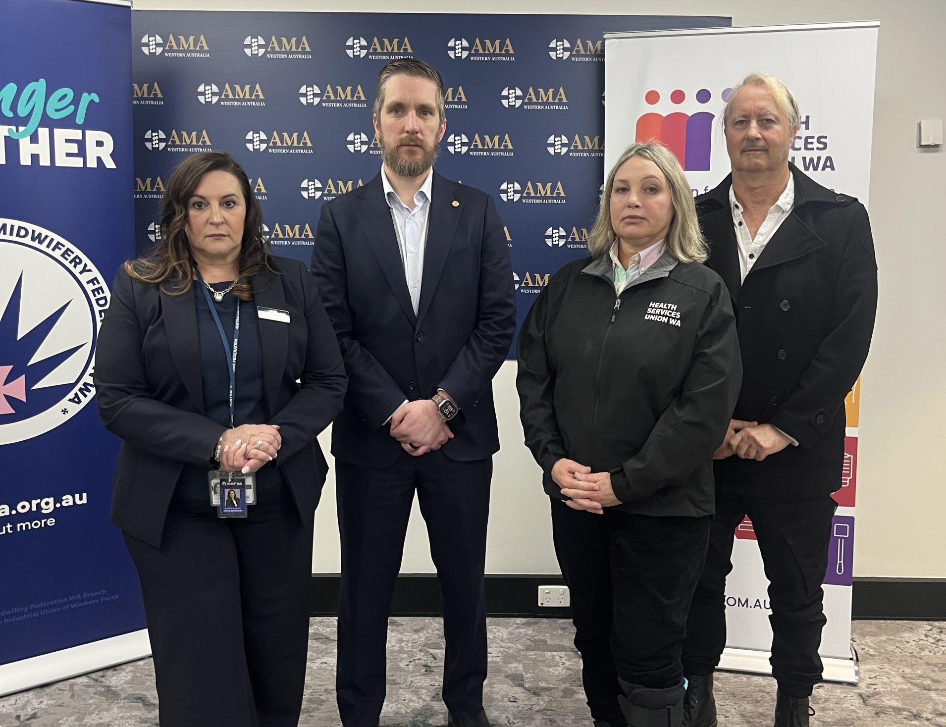 ANMF WA State Secretary Romina Raschilla, AMA WA President Dr Kyle Hoath, HSUWA Secretary Naomi McCrae and HSUWA President and Senior Clinical Psychologist Craig Russell stand together in front of union signage.