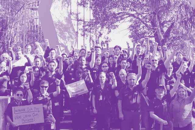 HSUWA Members from FSH Pharmacy taking action during the 2024 Union Agreement Campaign. They stand with fists in the air and some hold placards.