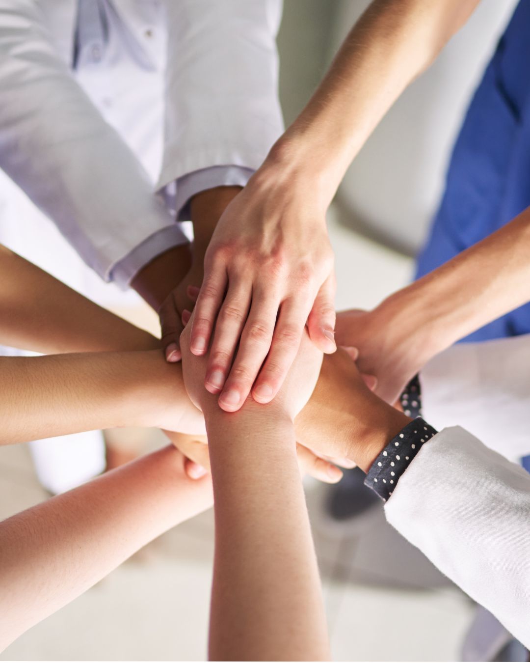 Health workers' hands together